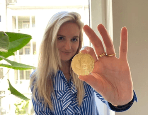 woman holding coin cryptocurrencies